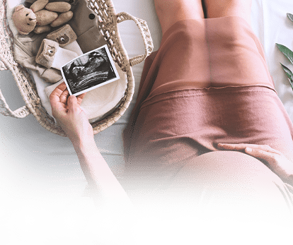 A pregnant woman checking her ultrasound scan.